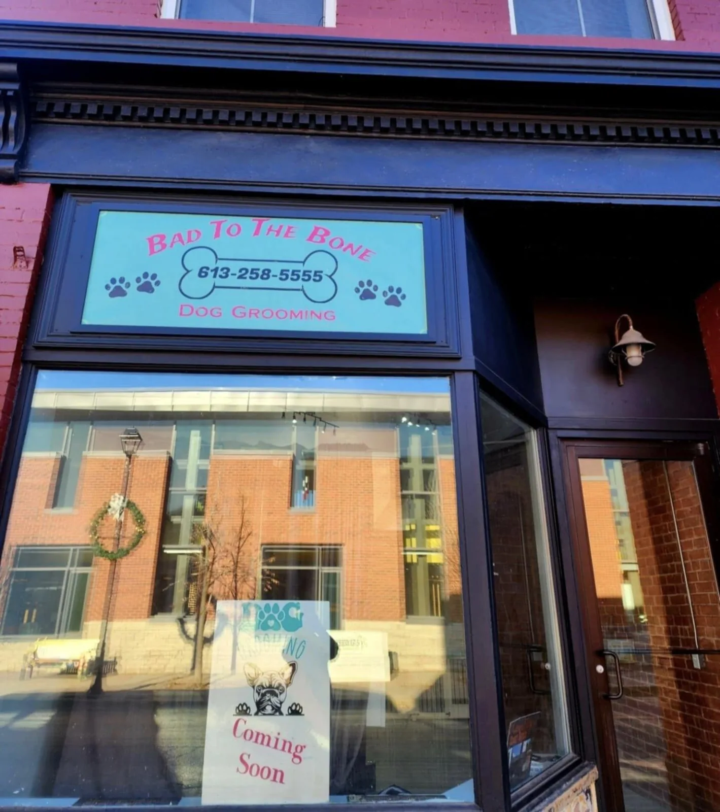 The Prescott Street storefront with its bone-and-paws window sign